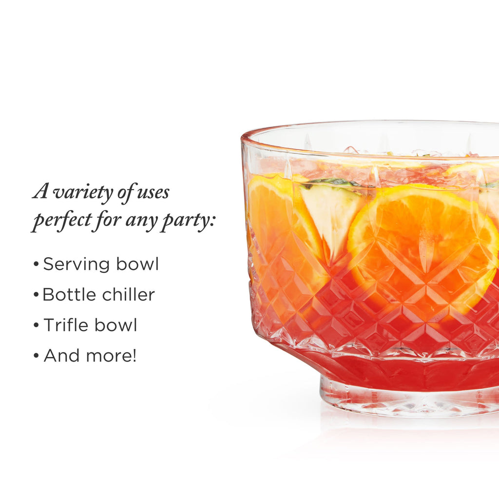 Glass serving bowl with fruit slices on a white background