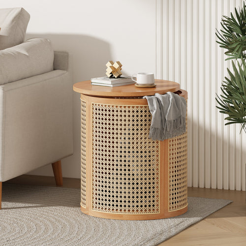 Round wicker side table with wooden top in a living room setting.