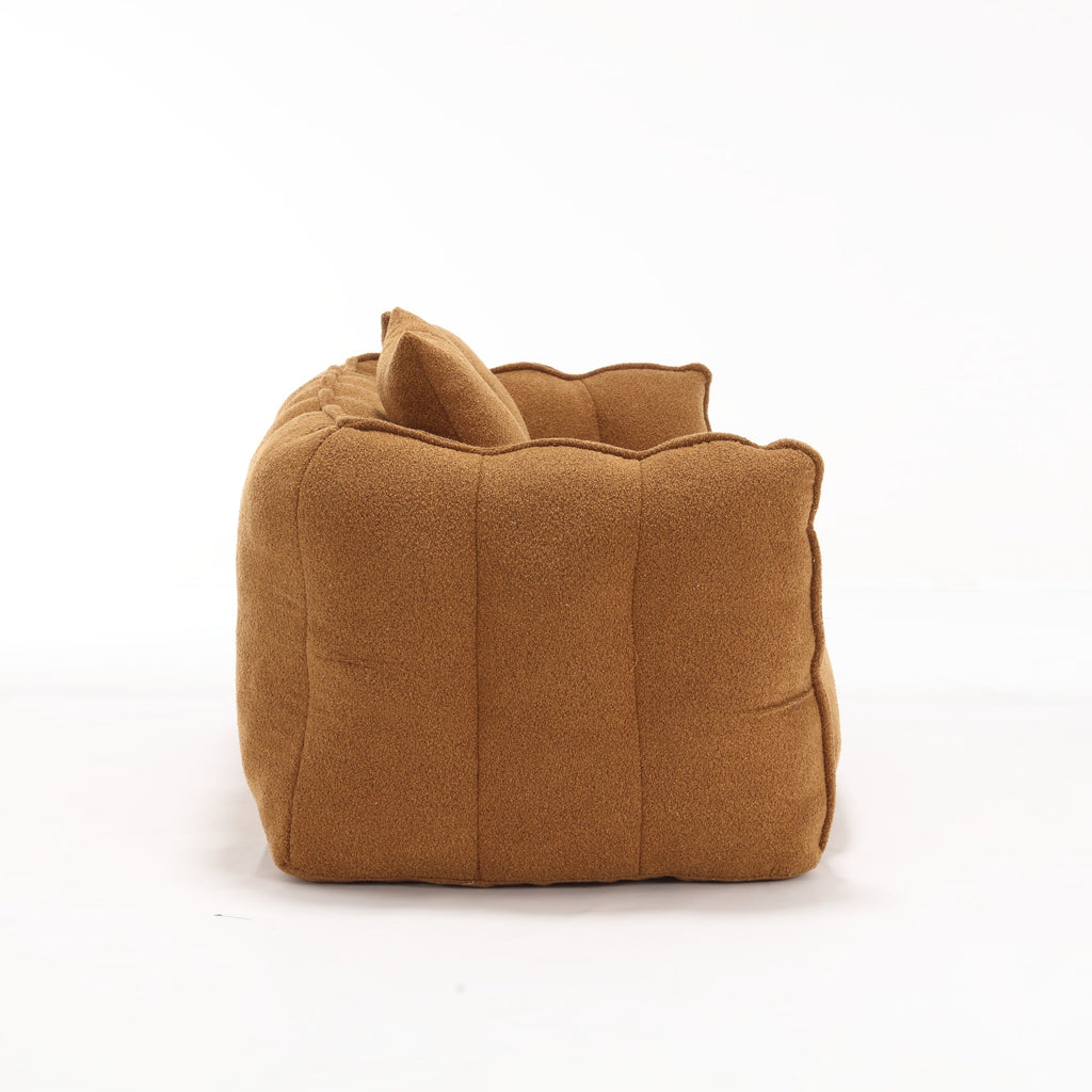 Brown fabric sofa side on a white background