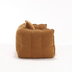 Brown fabric sofa side on a white background