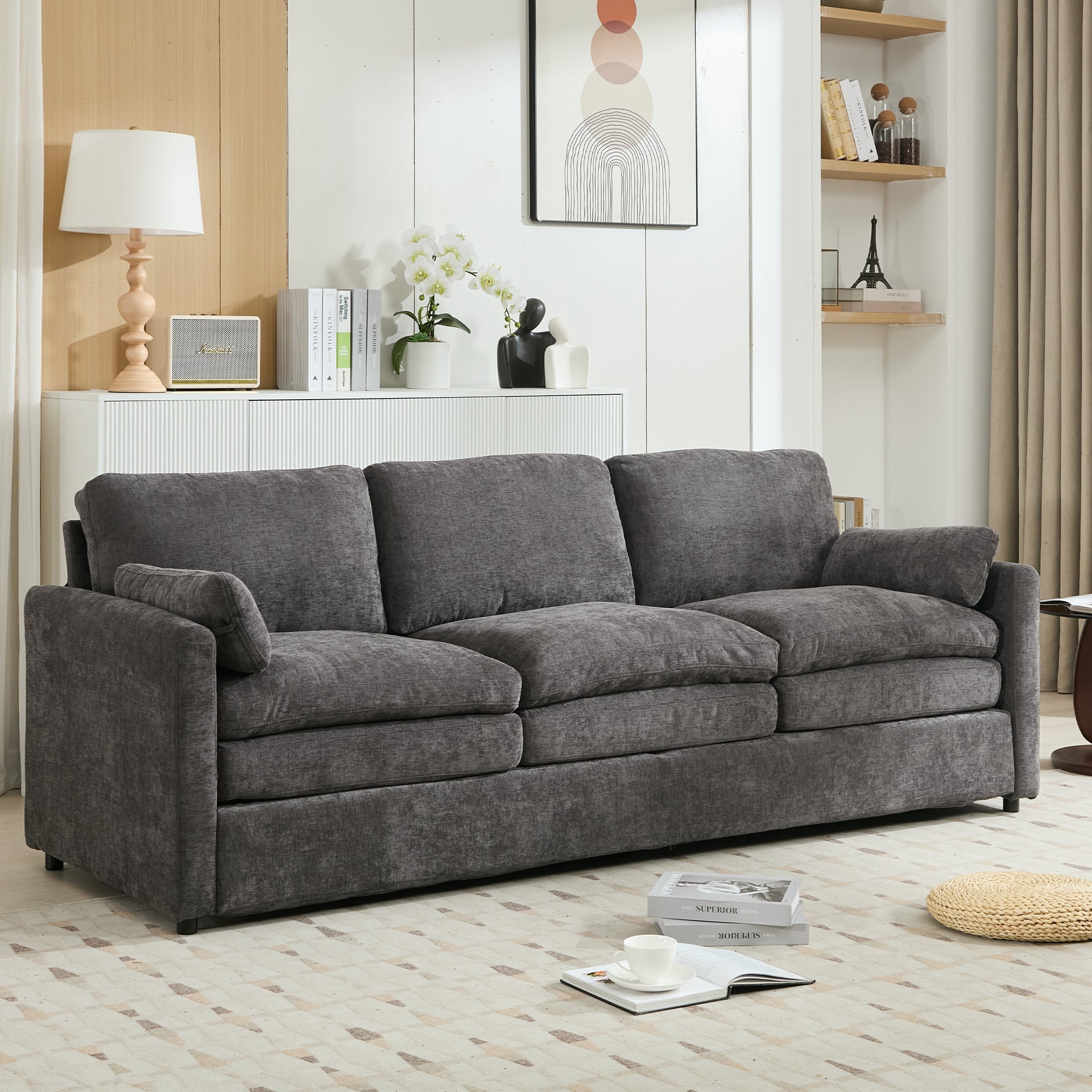 Gray sofa in a living room setting with decor elements.