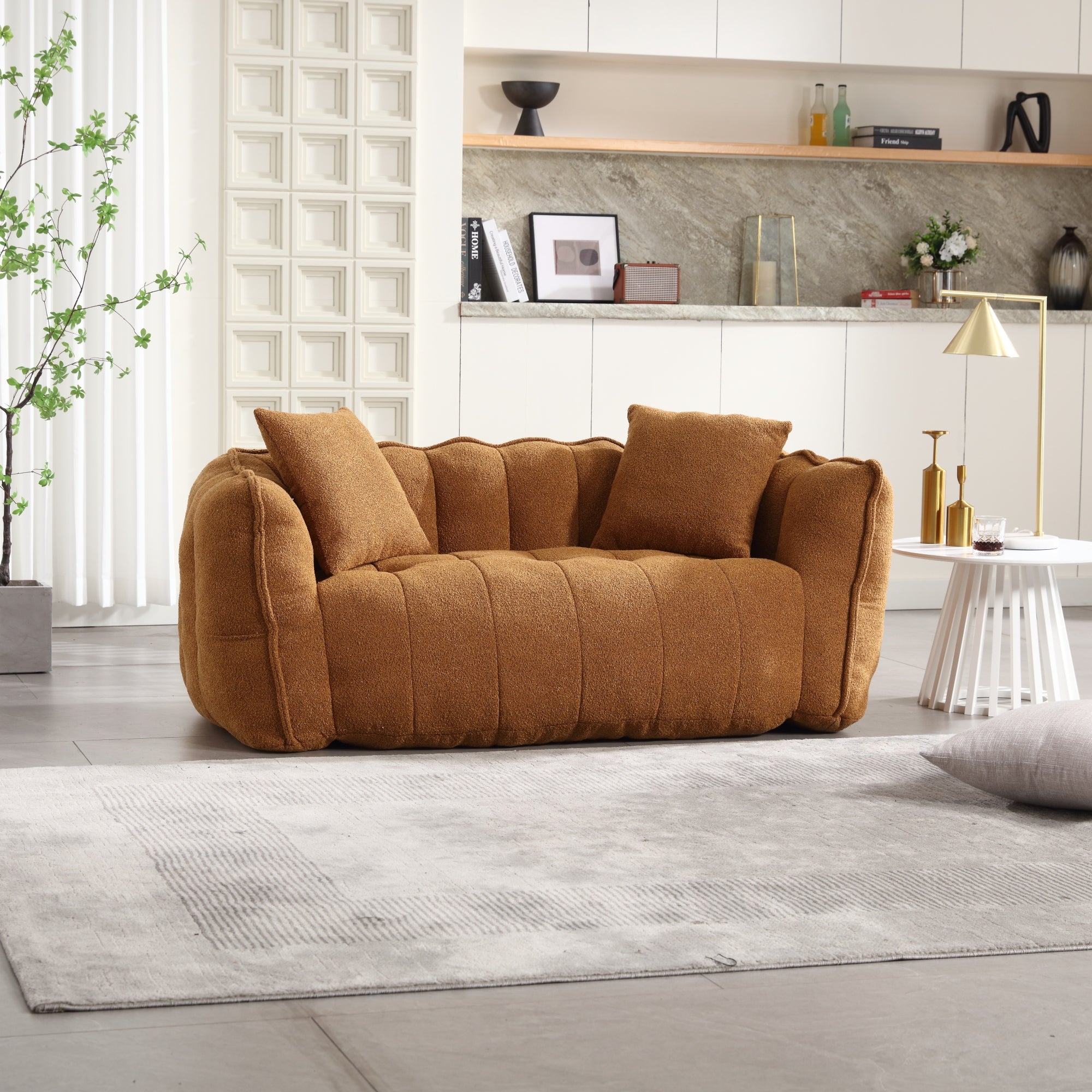 Brown sofa in a modern living room with a neutral color palette