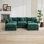 Green sectional sofa in a living room setting with a fireplace and decor.