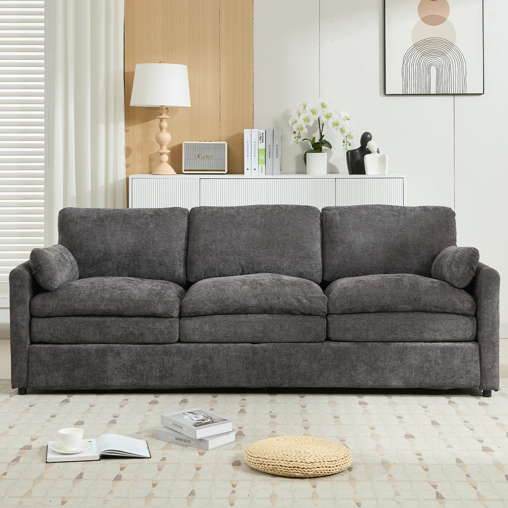 Gray sofa in a living room setting with decor items.