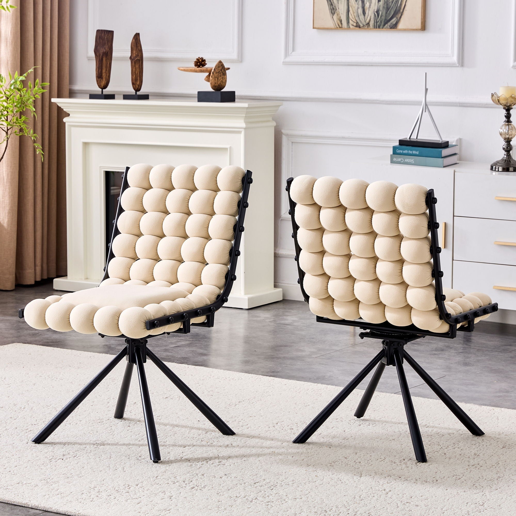 Two modern chairs with beige cushioned seats in a living room setting.