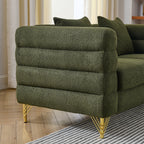Green textured sofa with gold legs in a living room setting