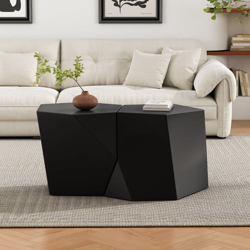 Modern living room with a black geometric coffee table and beige sofa.