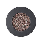 Round black fire pit with pebbles and a small metal ring inside on a white background