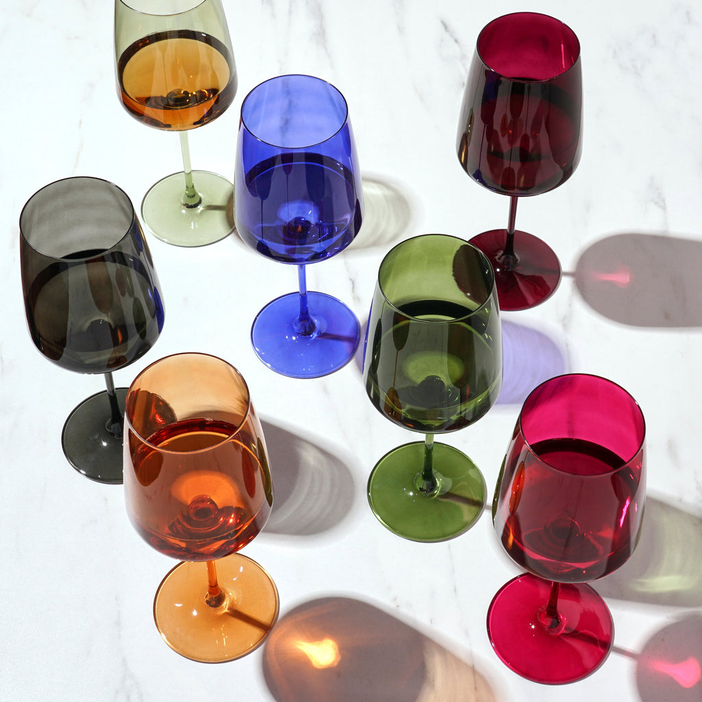 Colorful wine glasses on a white background