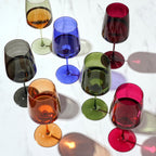 Colorful wine glasses on a white background