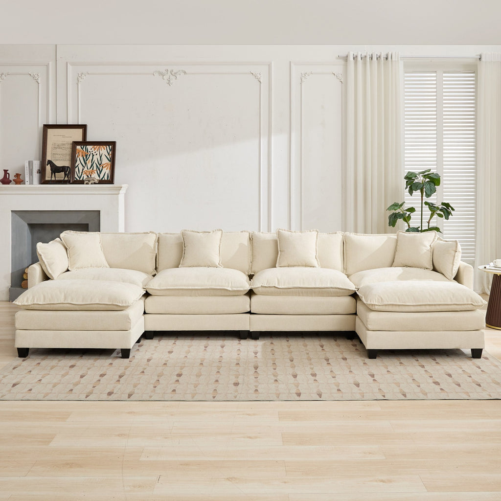 Beige sectional sofa in a living room with a fireplace and window.