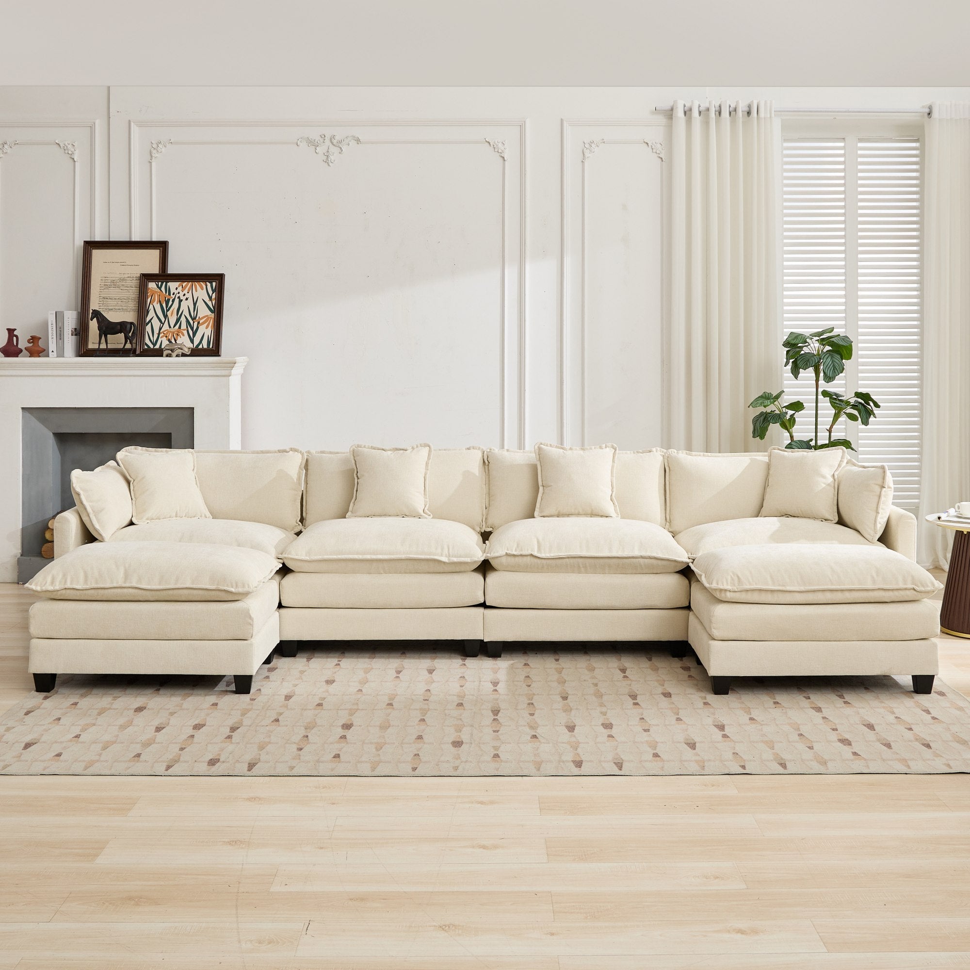 Beige sectional sofa in a living room with a fireplace and window.