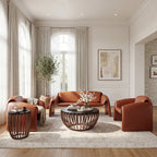 Modern living room with brown leather furniture and a wooden coffee table.