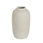 A small matte ceramic vase with a textured, speckled finish in a warm off-white or light beige color, shown against a plain white background.