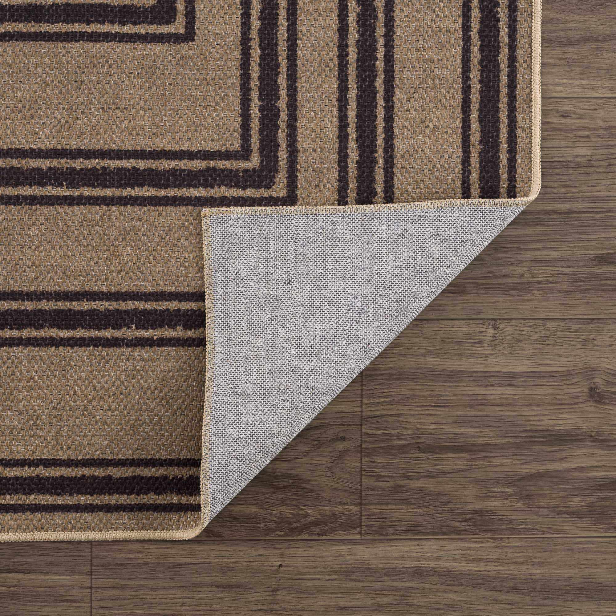 Rug with geometric pattern on a wooden floor