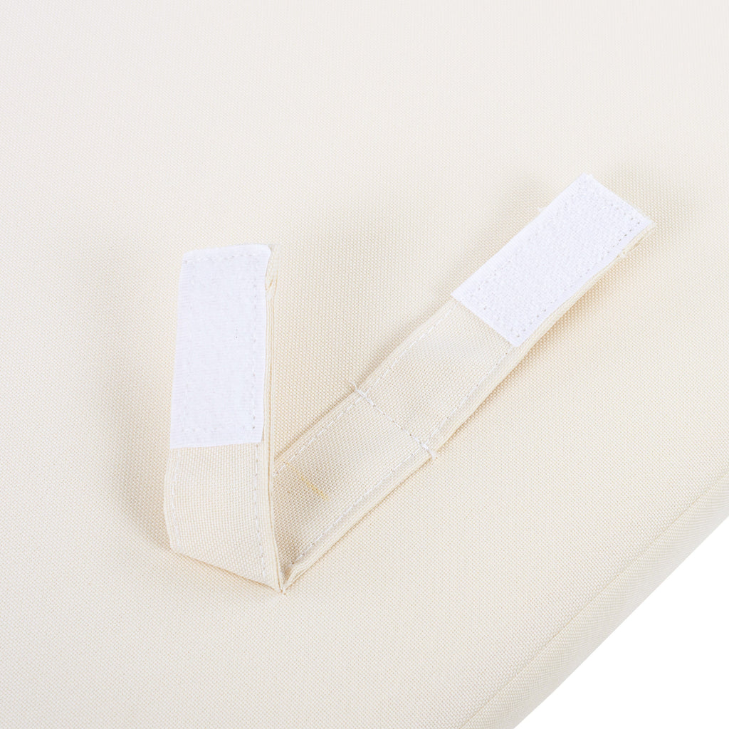 Close-up of a beige fabric with white stick-on on a white background
