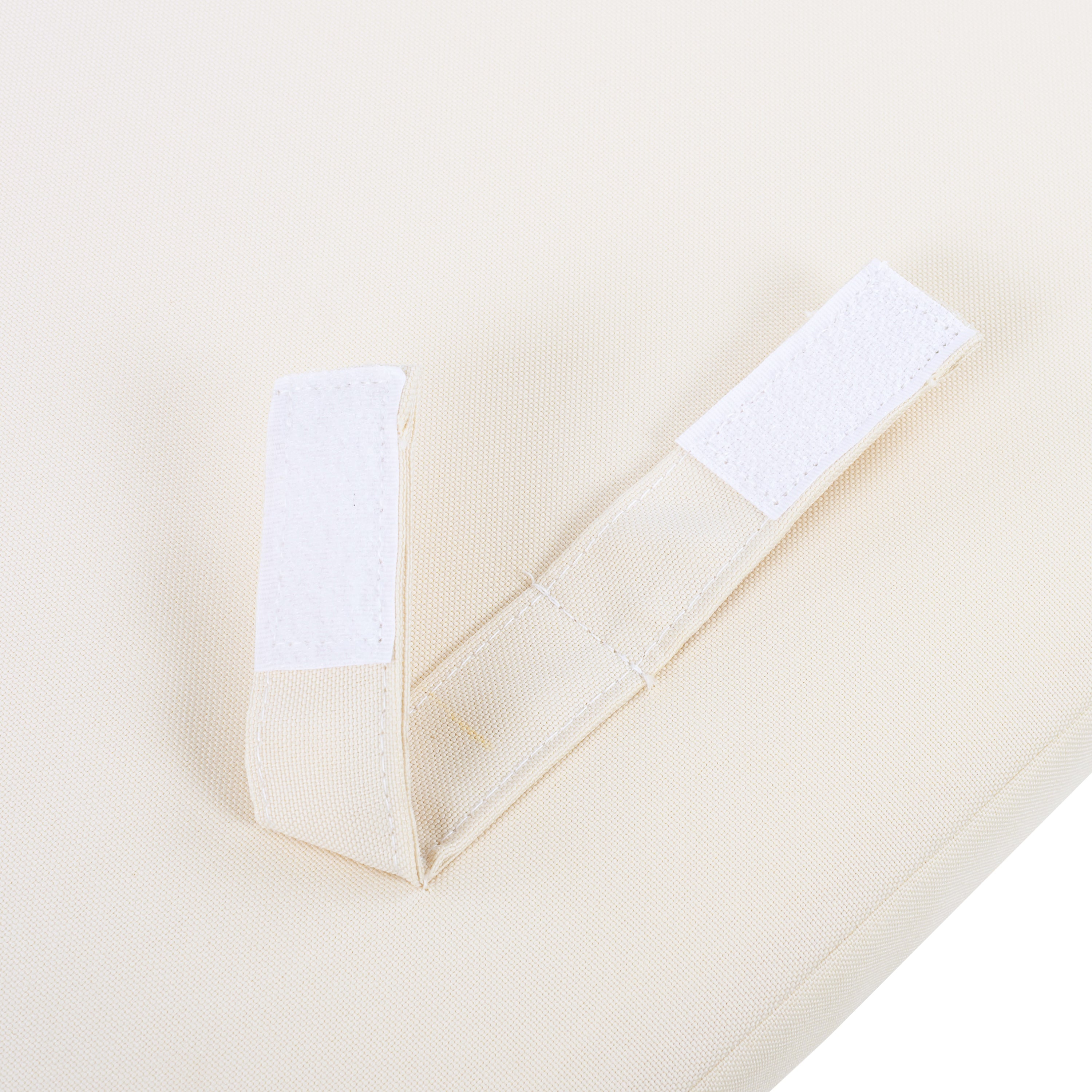 Close-up of a beige fabric with white stick-on on a white background