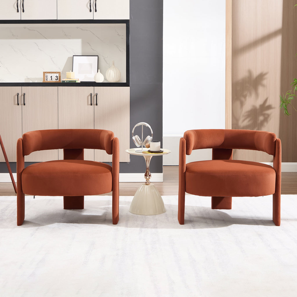 Two brown armchairs in a modern living room setting with a small table and decor items.