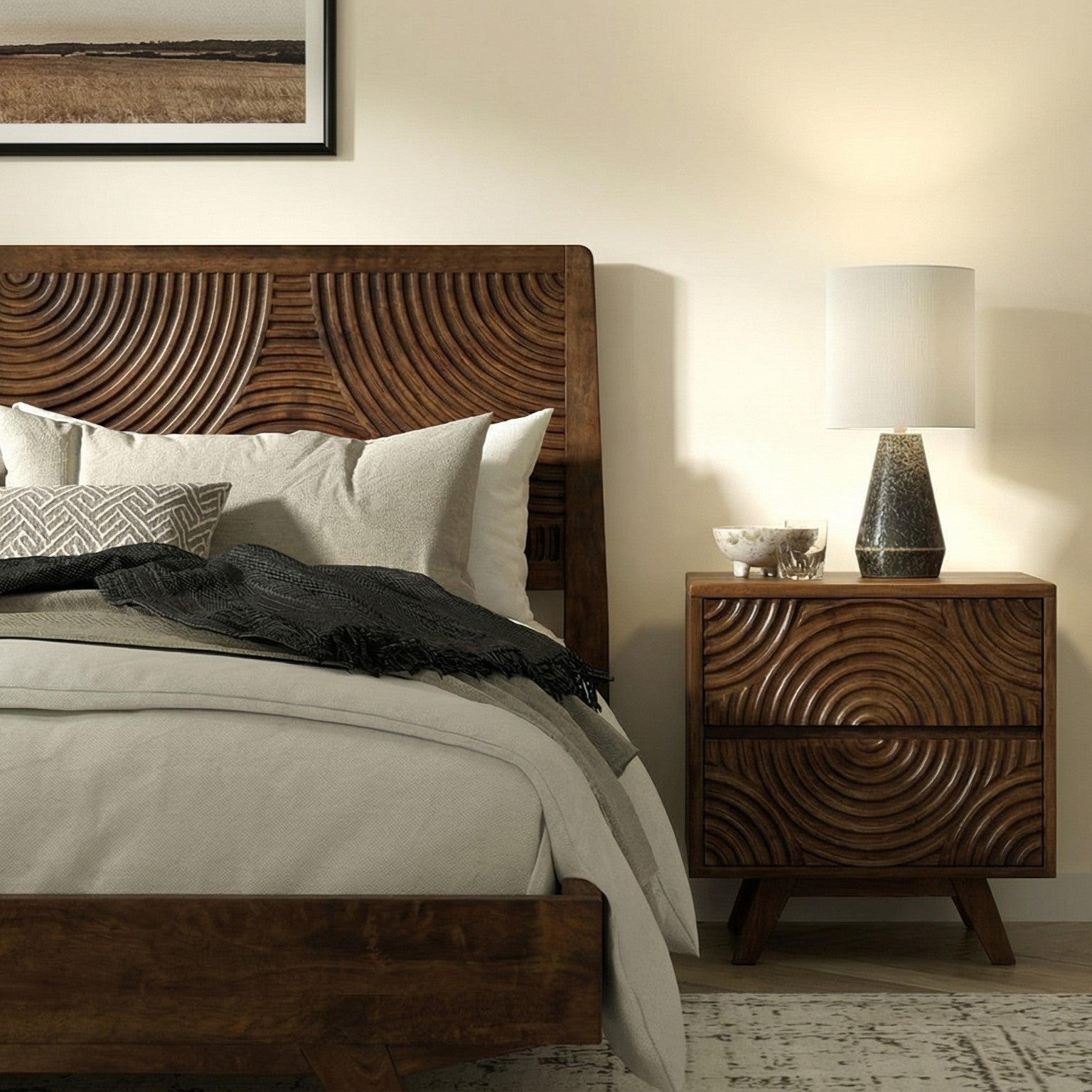 Wooden bed with intricate carvings and matching nightstand in a bedroom setting.