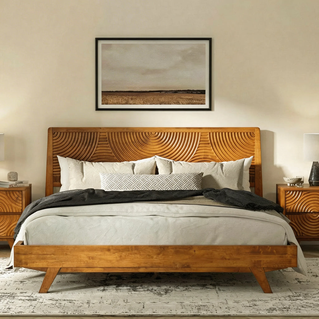 Wooden bed with decorative headboard in a bedroom setting