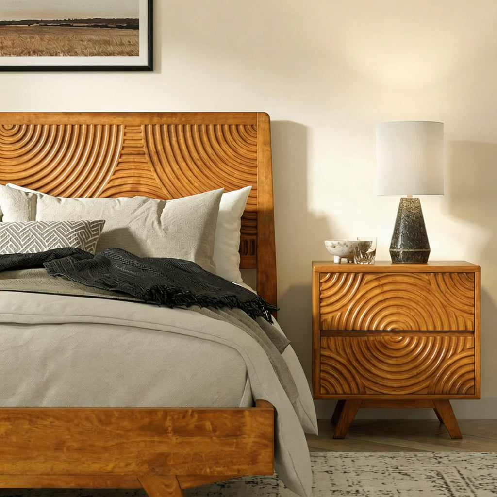 Wooden bed and nightstand with decorative patterns in a bedroom setting.