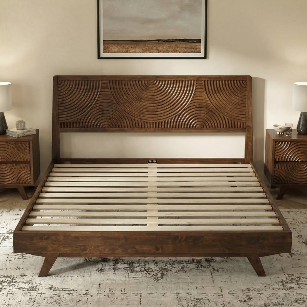 Wooden bed with intricate headboard in a bedroom setting