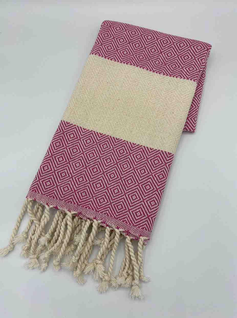 Hot pink diamond patterned hand towel with cream stripes and twisted fringe ends