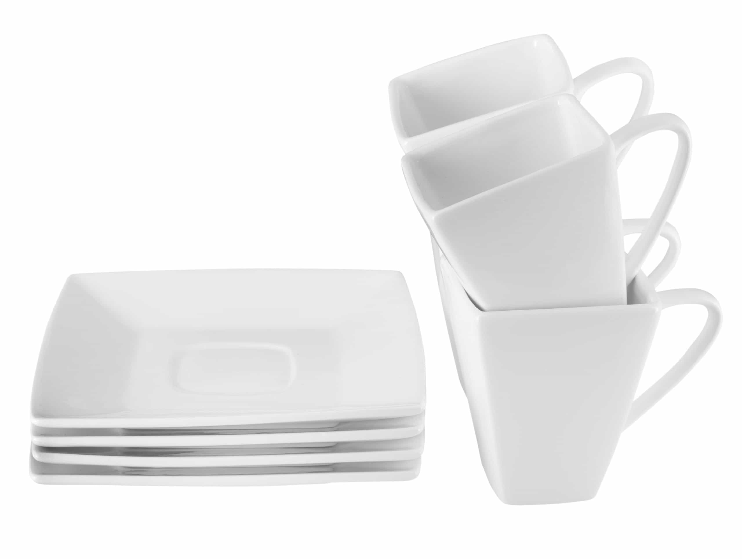 Set of four white square ceramic mugs and four matching square plates on white background