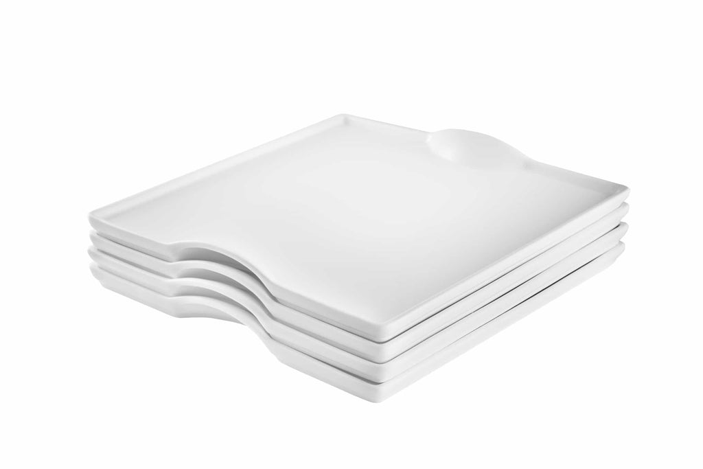 Stack of modern white square ceramic plates with a rounded notch and dip, minimalist serving platter