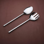 Stainless steel spoon and fork on a brown background