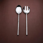 Silver spoon and fork on a brown background