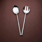 Silver spoon and fork on a brown background