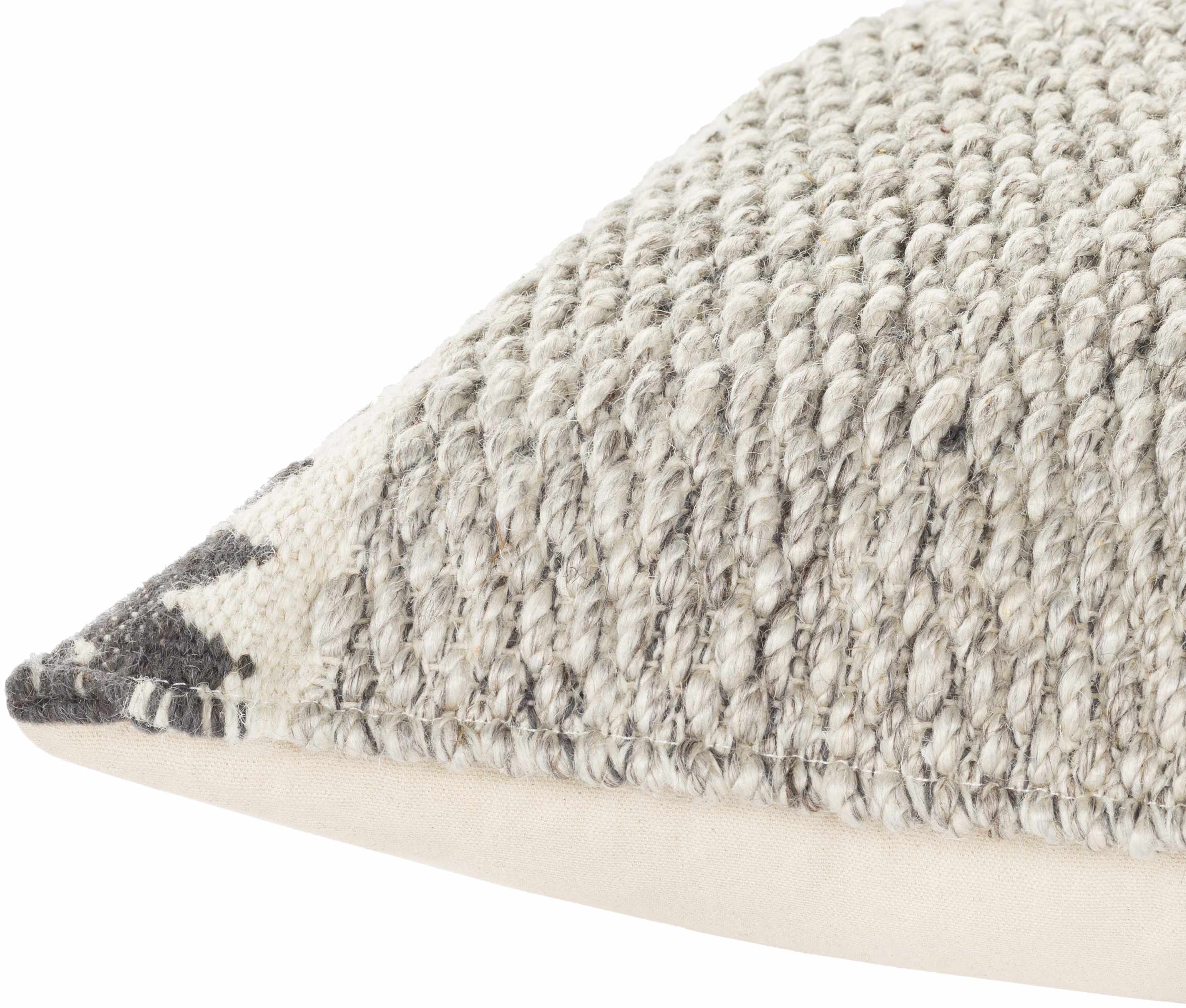 Textured pillow with a geometric pattern on a white background