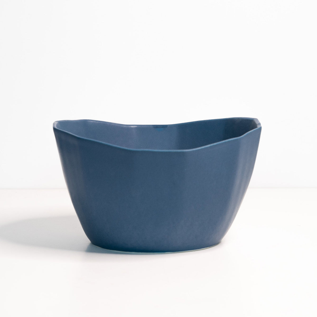 Blue ceramic bowl on a white background