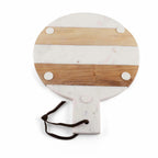 Round cutting board with marble and wood design on a white background
