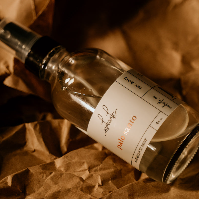 Glass bottle with a label on a brown textured background