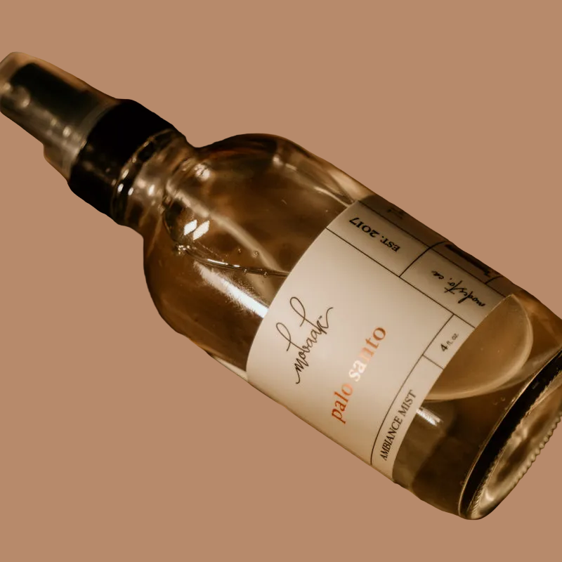 Glass bottle with a label on a brown background