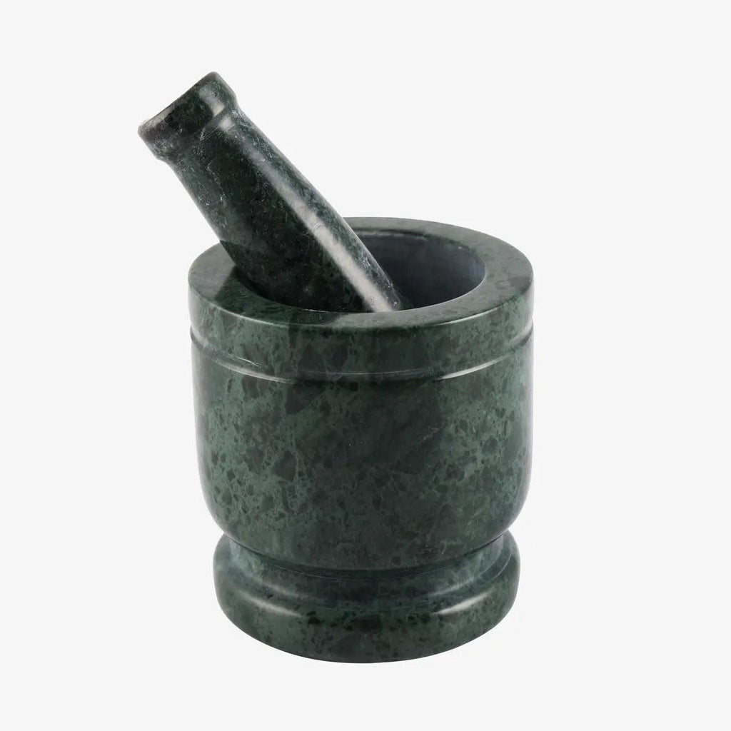 Dark green marble mortar and pestle set on a plain white background.