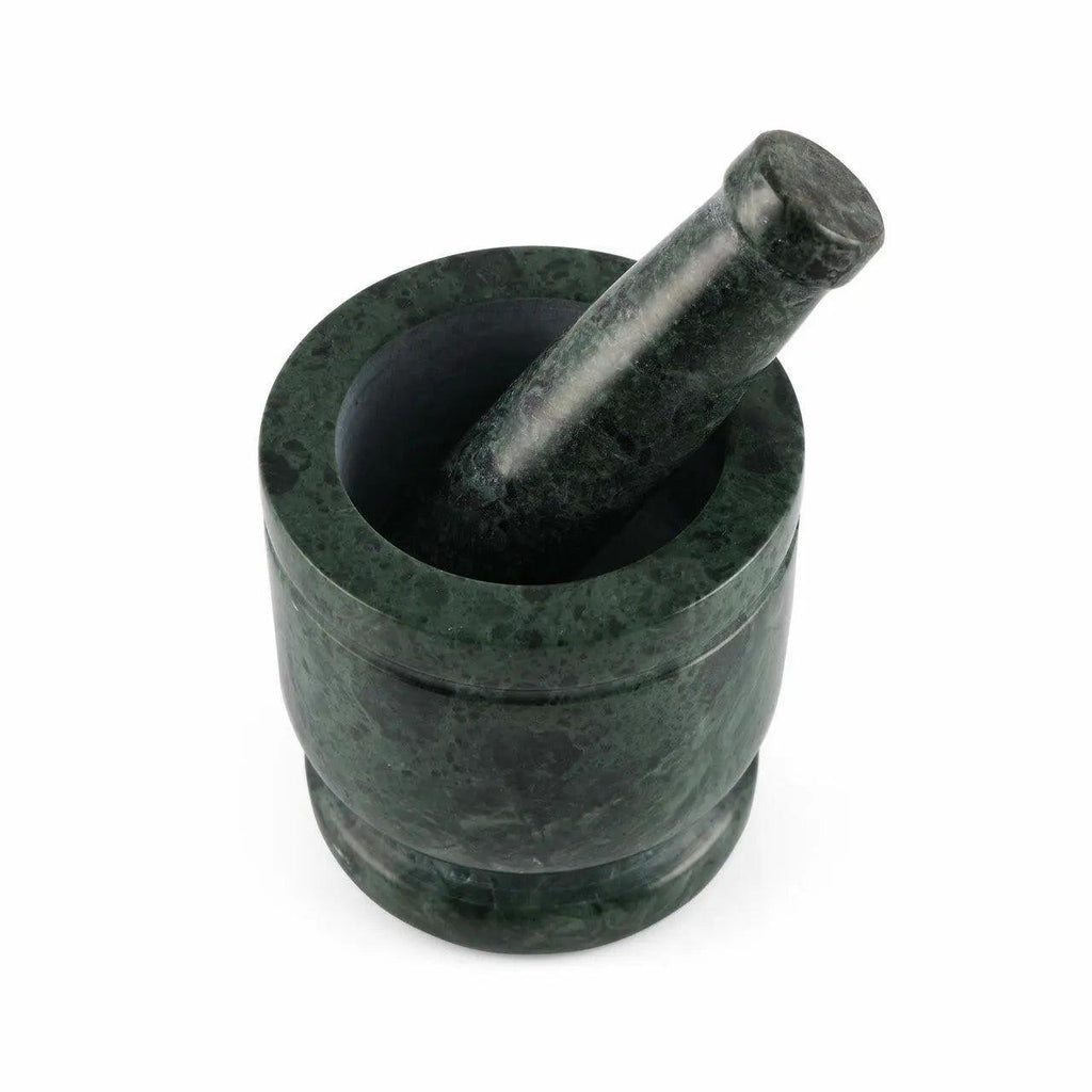 Green marble mortar and pestle on a white background