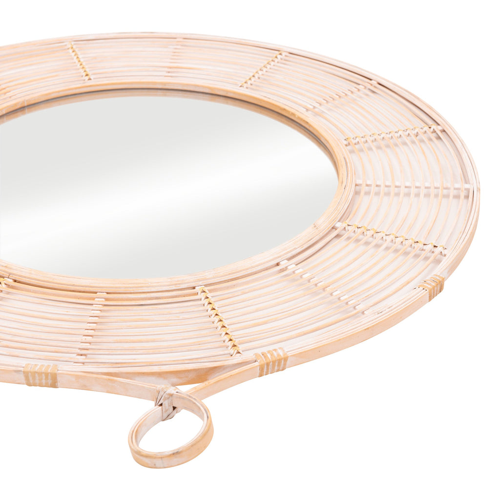 Round mirror with wicker frame on a white background