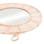 Round mirror with wicker frame on a white background