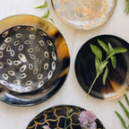 Set of decorative plates with unique patterns on a light background