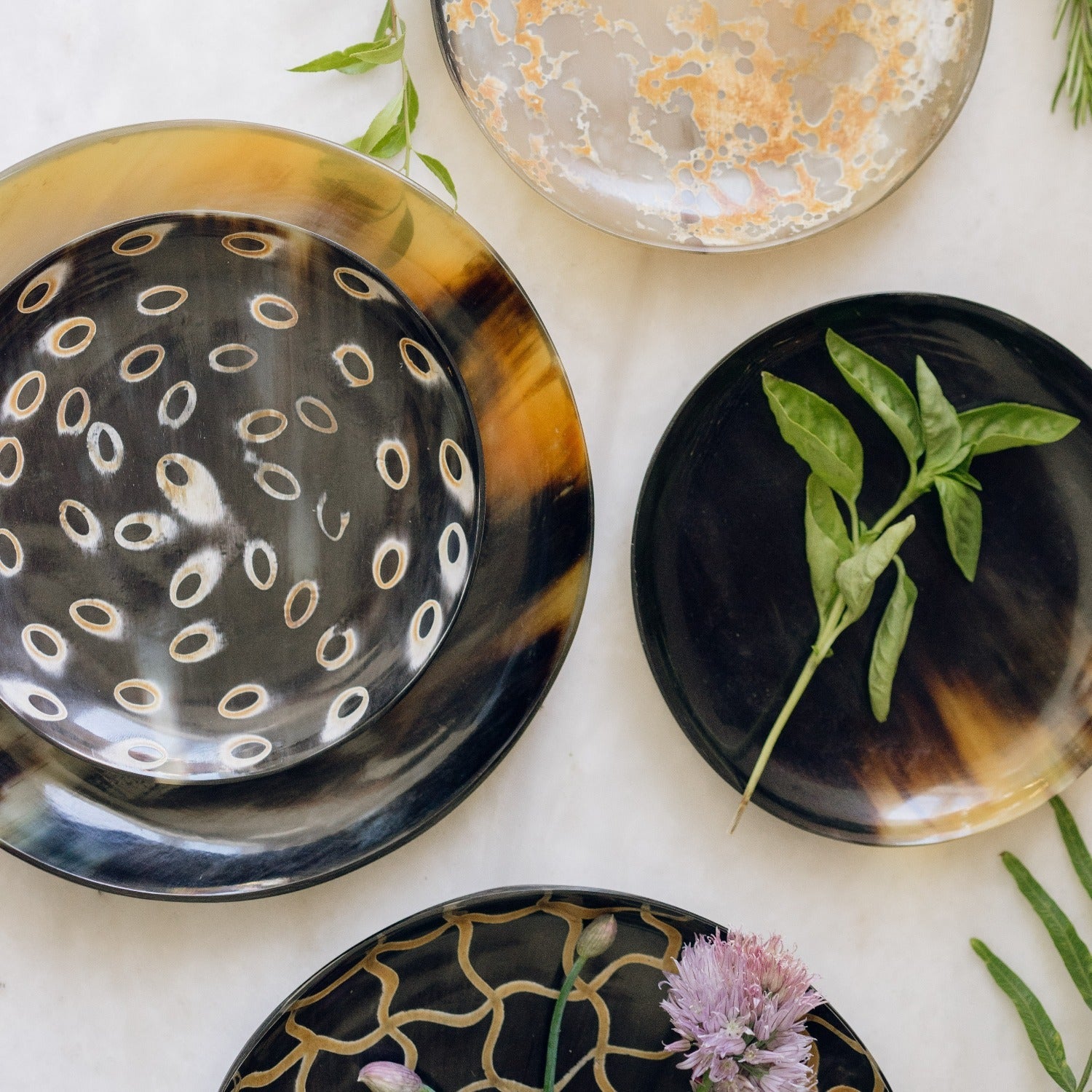 Set of decorative plates with unique patterns on a light background