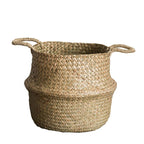 Woven basket with handles on a white background
