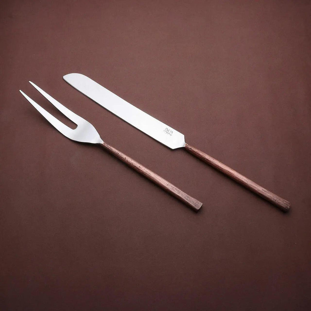 Sundance meat carving knife and two-tined fork with textured copper-toned handles, angled together on a brown background.