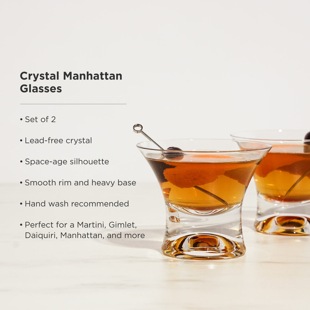 Crystal Manhattan glasses with a cocktail, set of 2, on a light background.